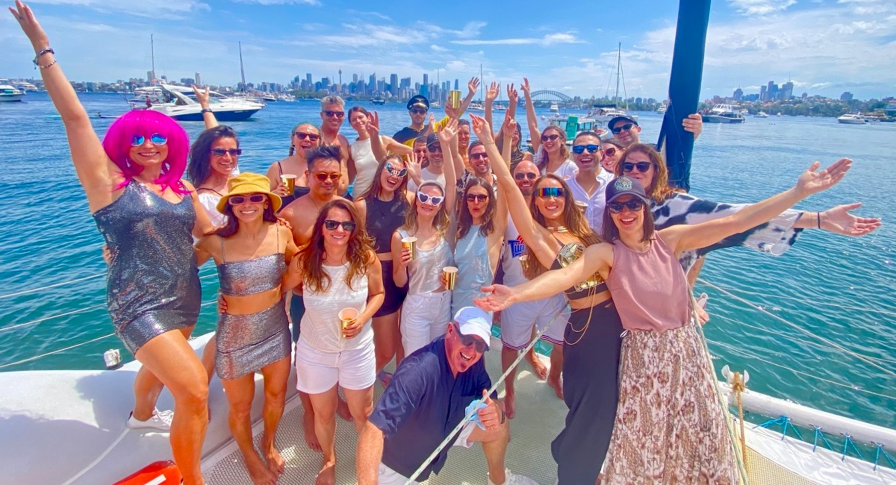 WanderBuddies group on a catamaran on Sydney Harbour