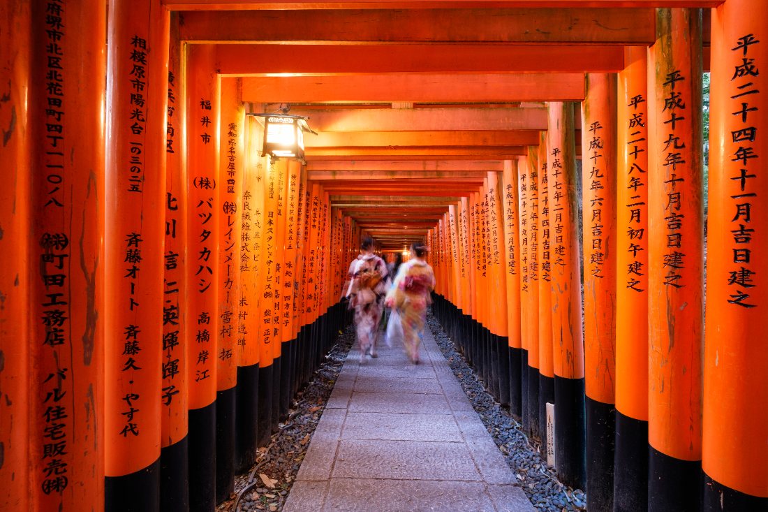 Walking through the torii gates of Fushimi Inari, Kyoto, Japan